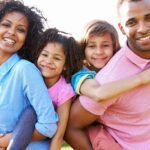 A happy family with two children enjoying the outdoors.